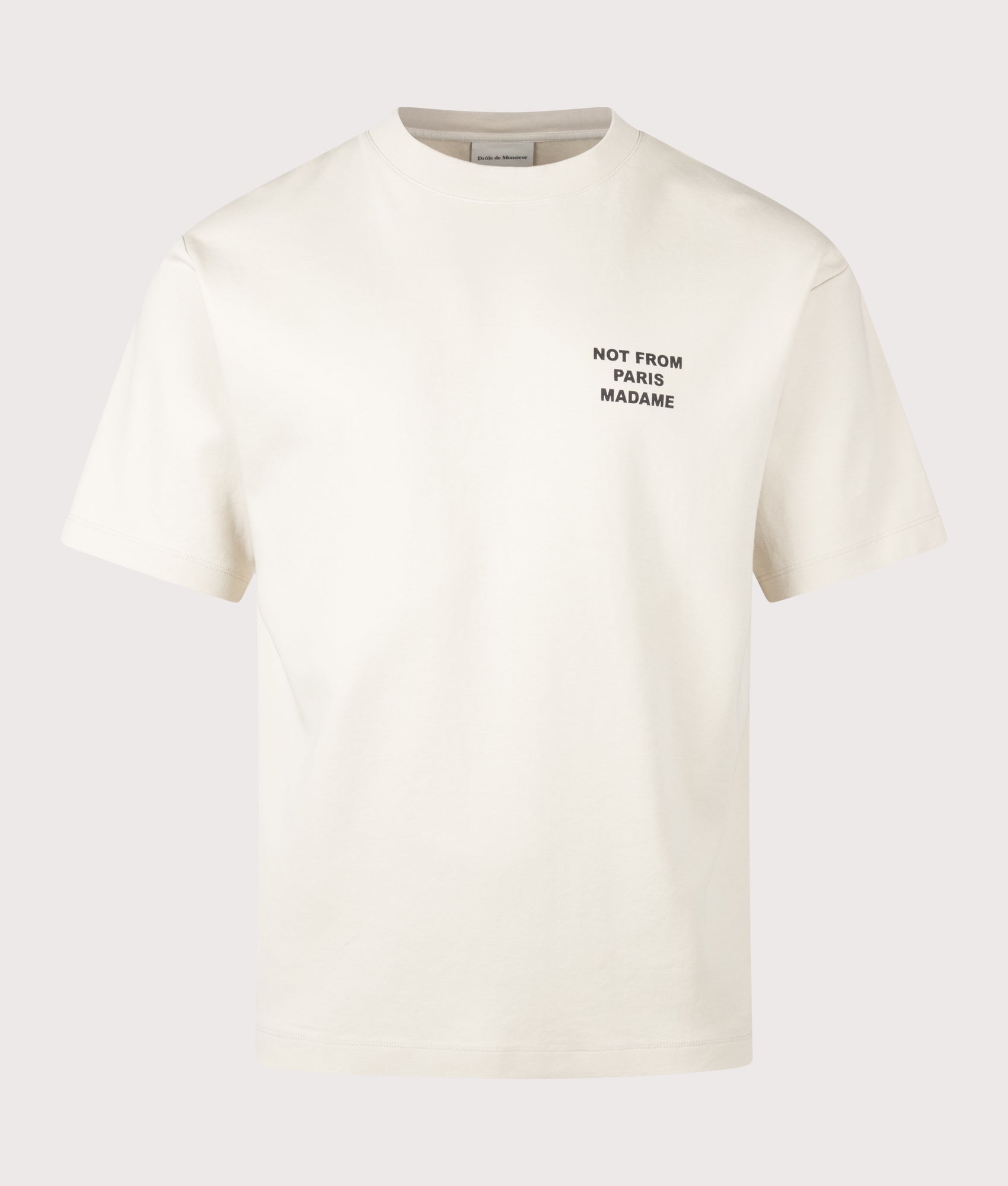 Drôle de Monsieur Slogan T-Shirt in Mastic at EQVVS Menswear. Front shot.