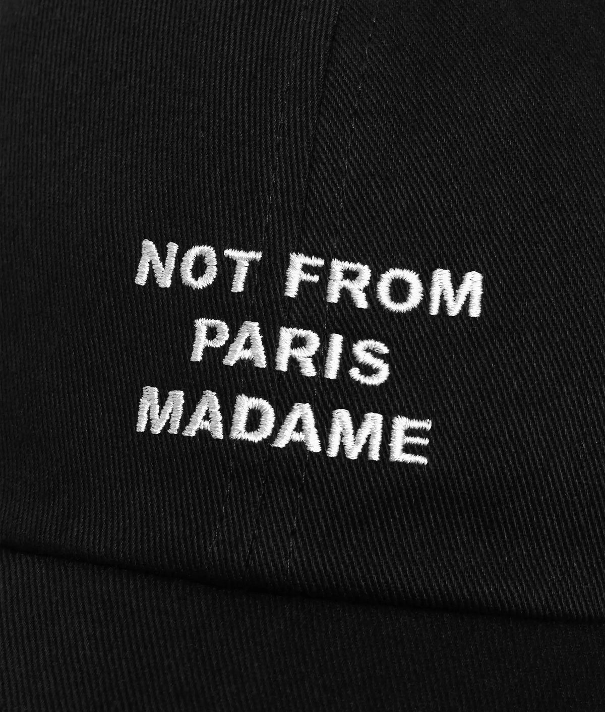 Drôle de Monsieur Slogan Cap in Black at EQVVS Menswear. Detail shot.