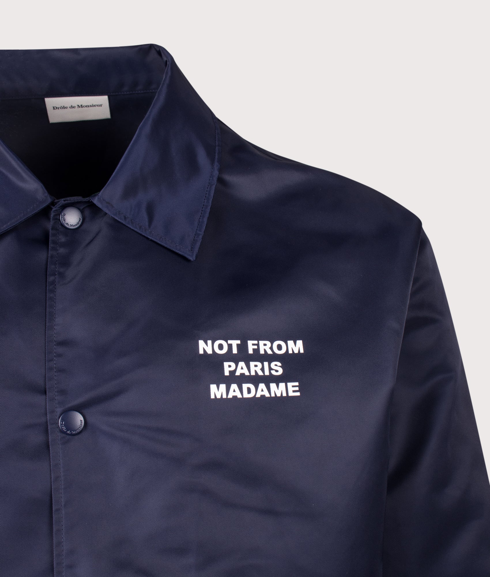 Slogan Jacket in Navy 
by Drôle de Monsieur. Shot by EQVVS. Detail shot.