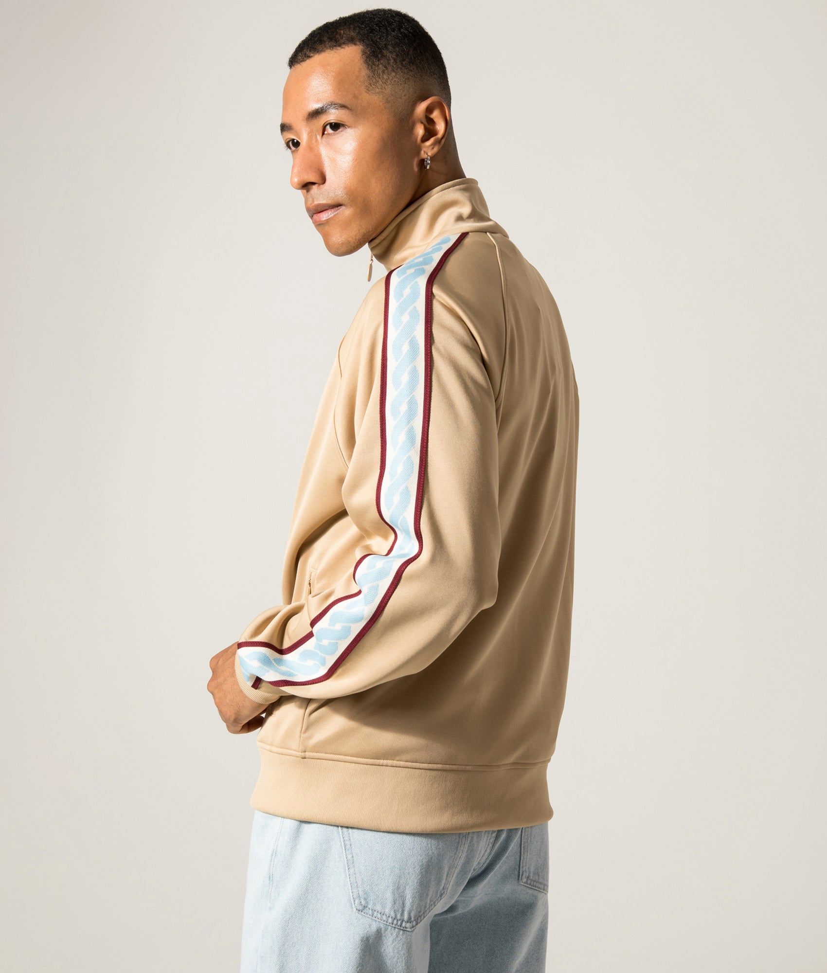 La Veste Survítement Track Top. Shot by EQVVS. Front angled model shot.