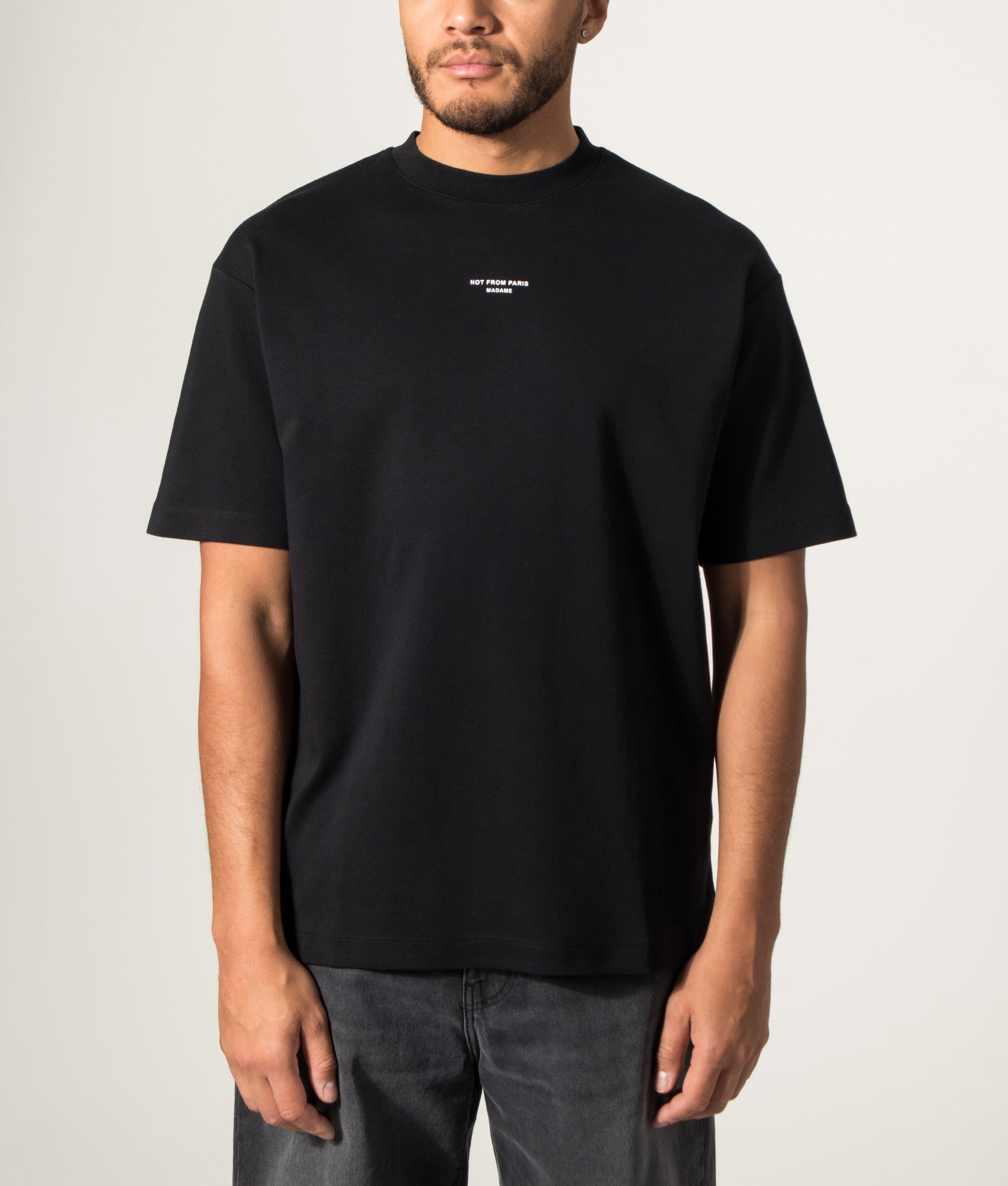 Drôle de Monsieur Relaxed Fit Classic Slogan T-shirt in Black at EQVVS Menswear. Model front shot.