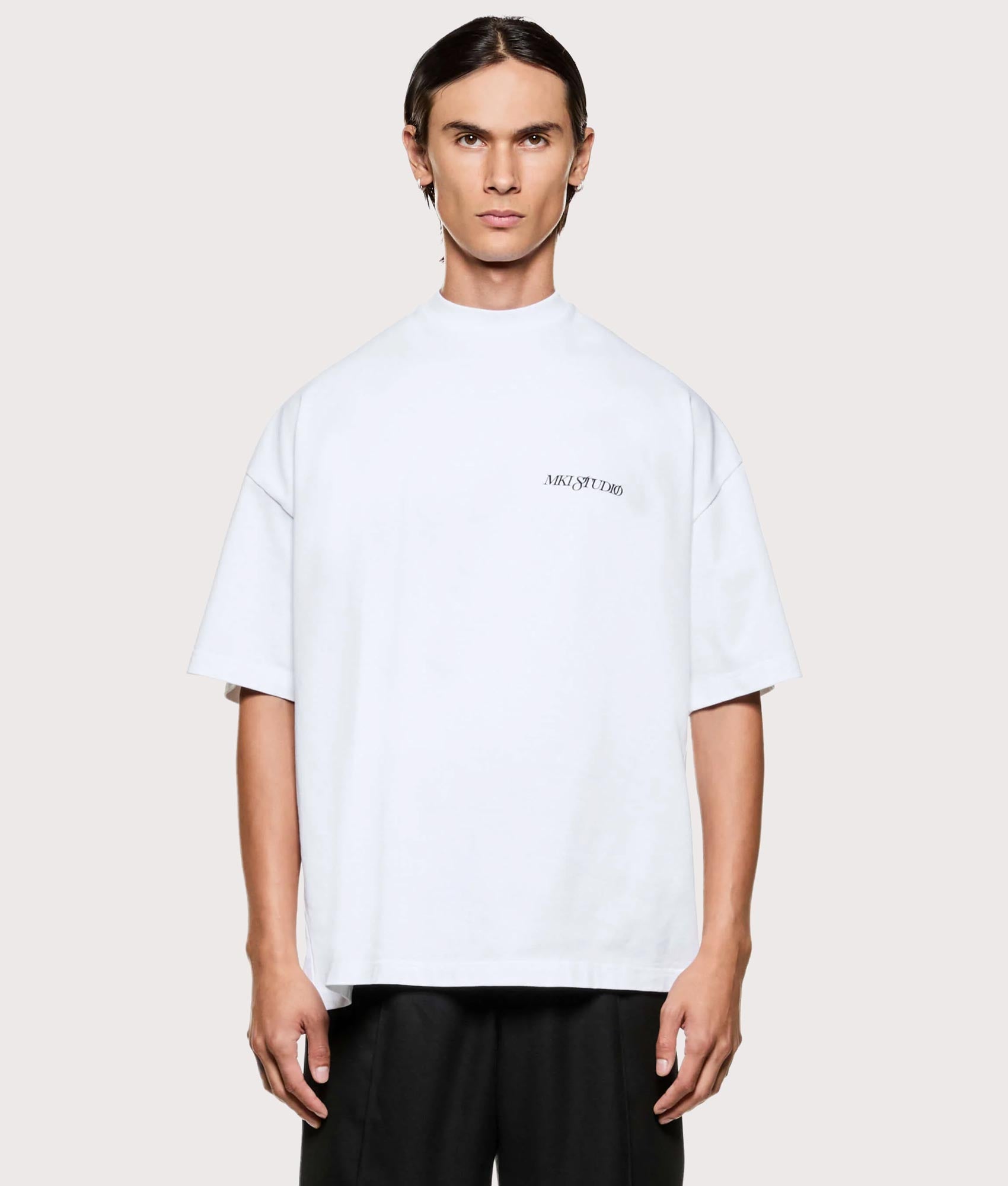 MKI MIYUKI ZOKU Script T shirt in White at EQVVS Menswear. Model front shot.