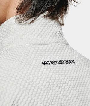 Seersucker Quarter Zip Sweatshirt. Shot by EQVVS. Back model detail shot.