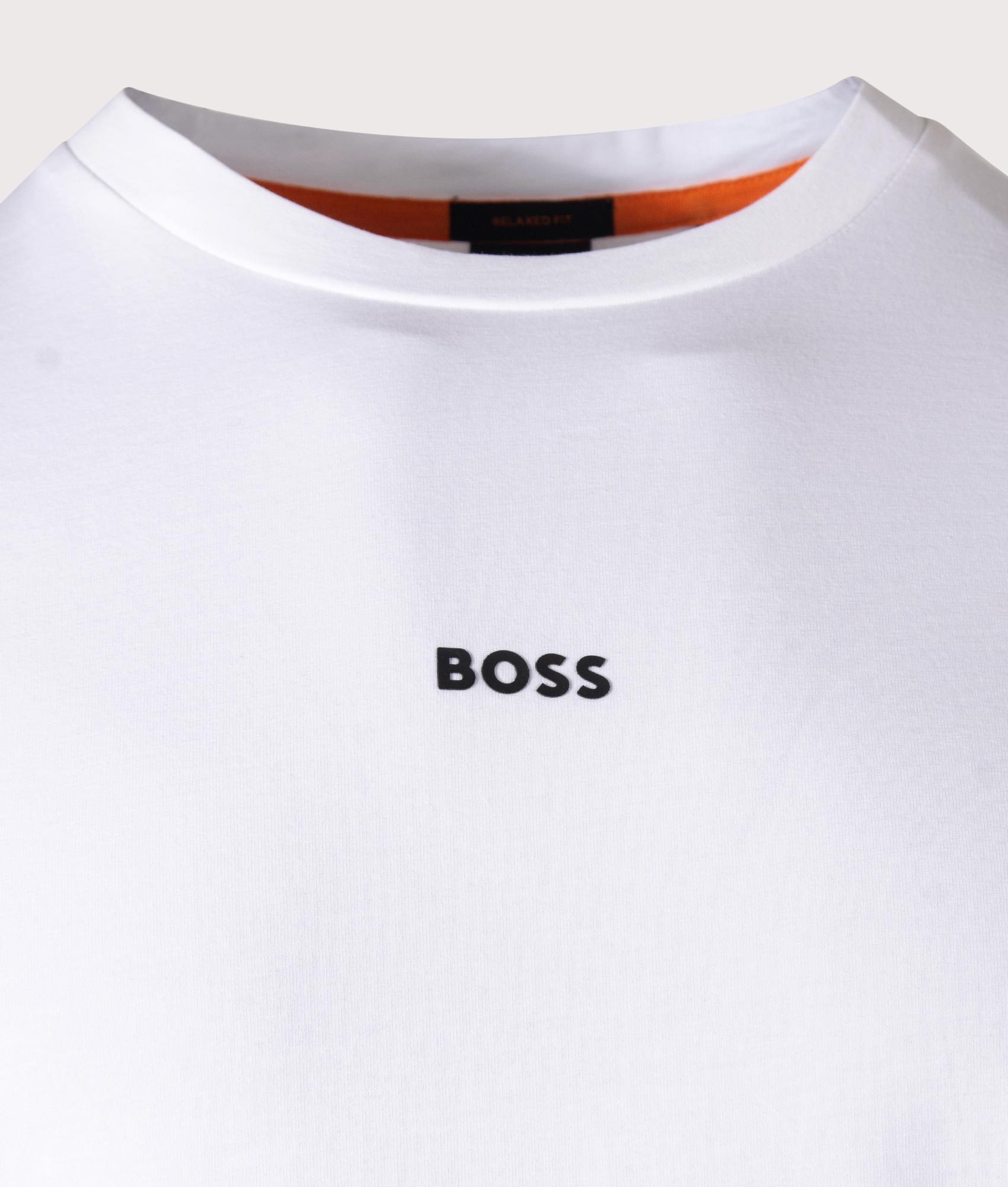 BOSS Relaxed Fit T-Chup T-Shirt in White at EQVVS Menswear. Detail shot.