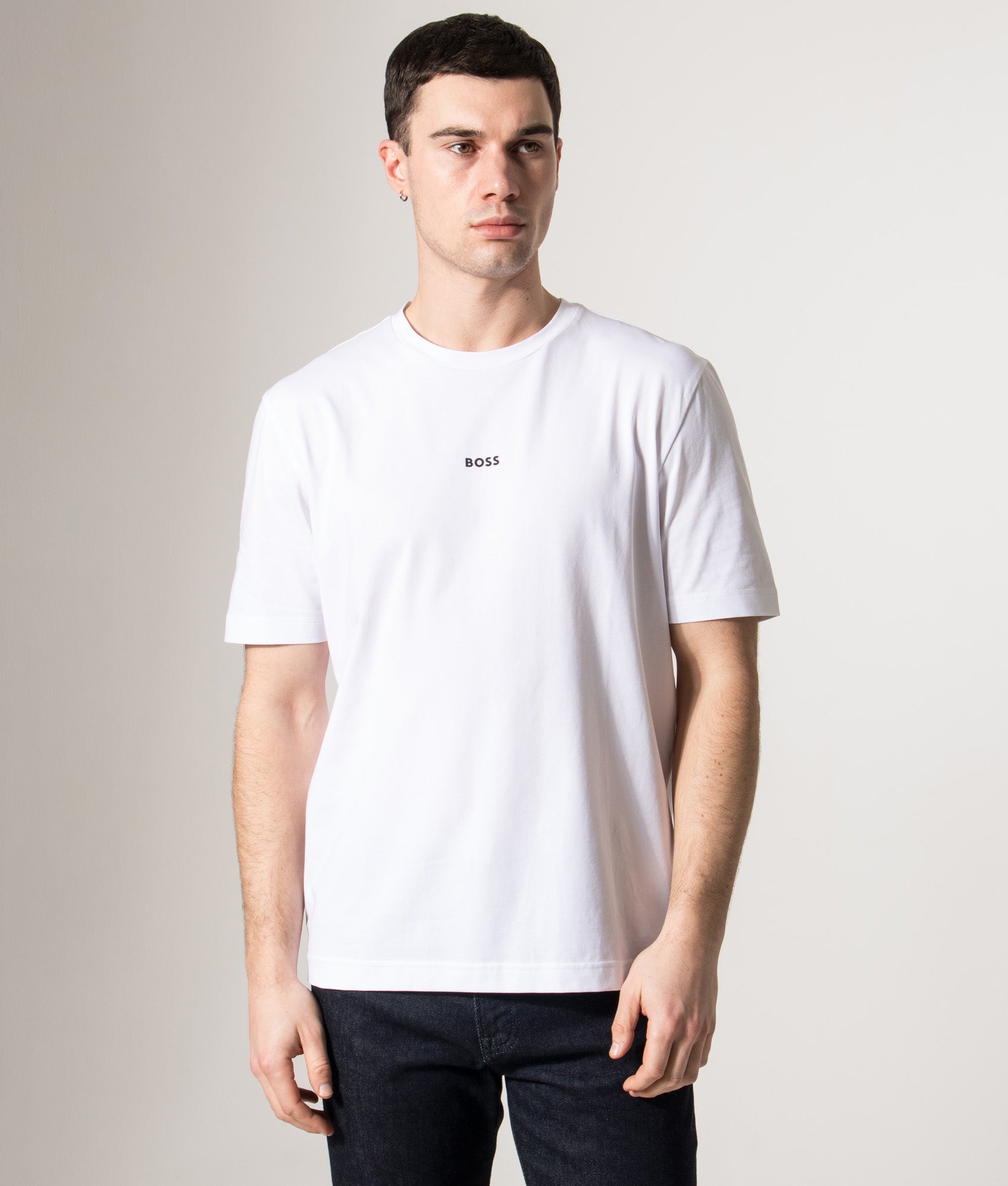 BOSS Relaxed Fit T-Chup T-Shirt in White at EQVVS Menswear. Model front shot.