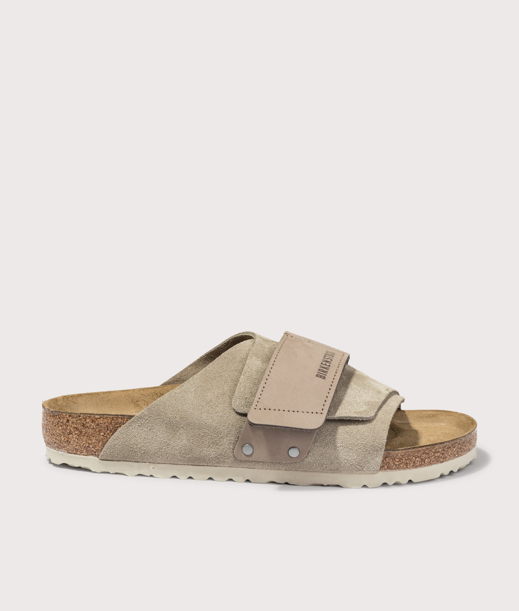 BIRKENSTOCK Kyoto Nubuck-Suede Leather Sandals in Taupe at EQVVS Menswear. Side shot.