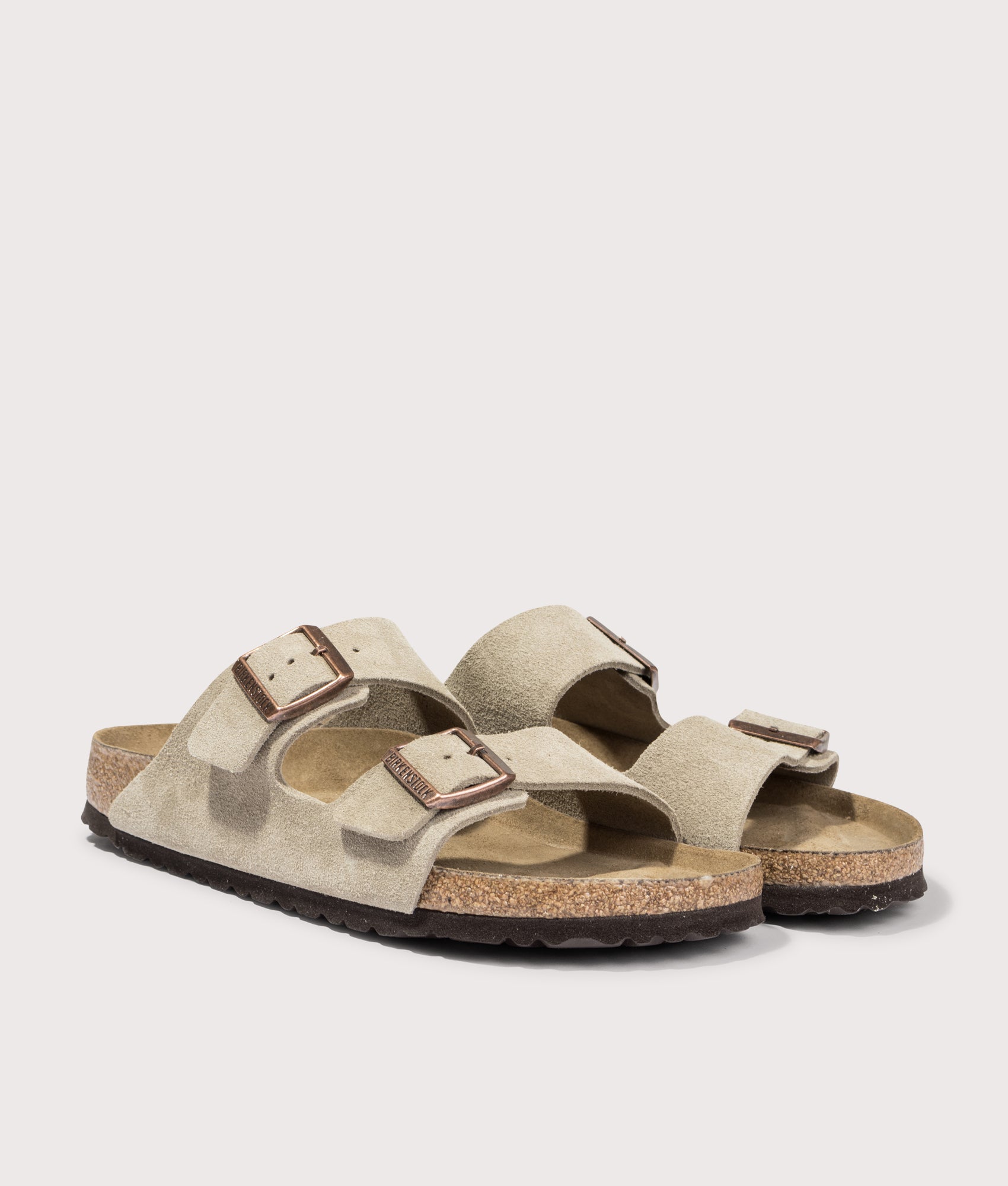 Arizona Narrow Fit Suede Leather Sandals by Birkenstock in Taupe. Shot by EQVVS. Front detail shot.