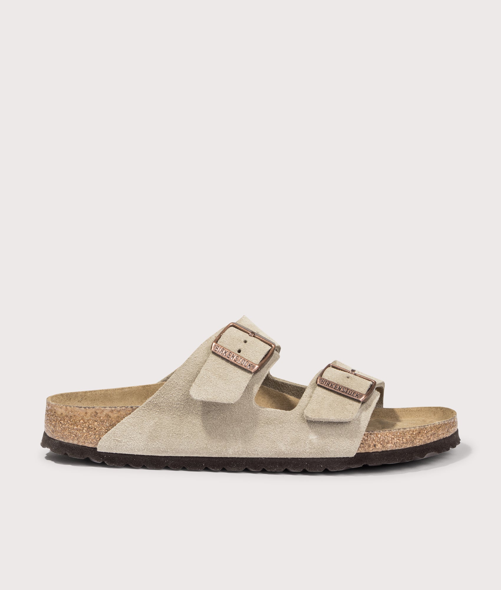 Arizona Narrow Fit Suede Leather Sandals by Birkenstock in Taupe. Shot by EQVVS. Front shot.