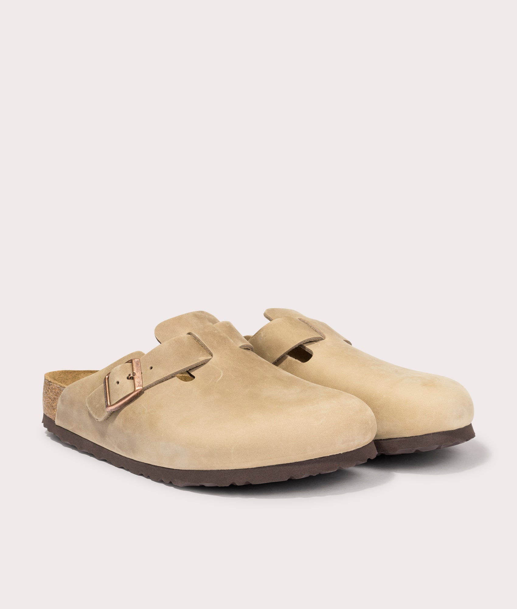 Birkenstock Boston Oiled Leather Clogs in Tobacco Brown at EQVVS Menswear. Angled front shot.