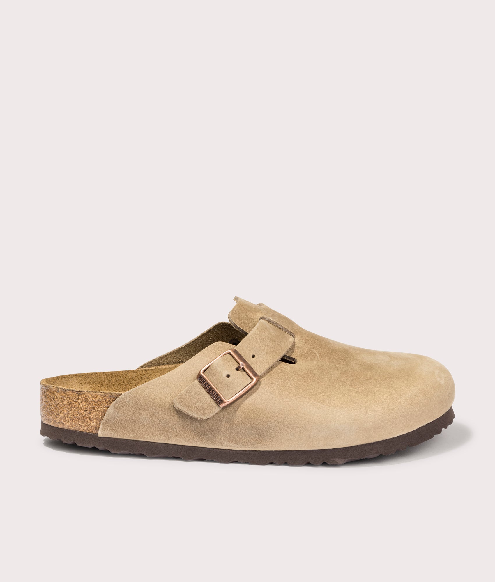 Birkenstock Boston Oiled Leather Clogs in Tobacco Brown at EQVVS Menswear. Side shot.