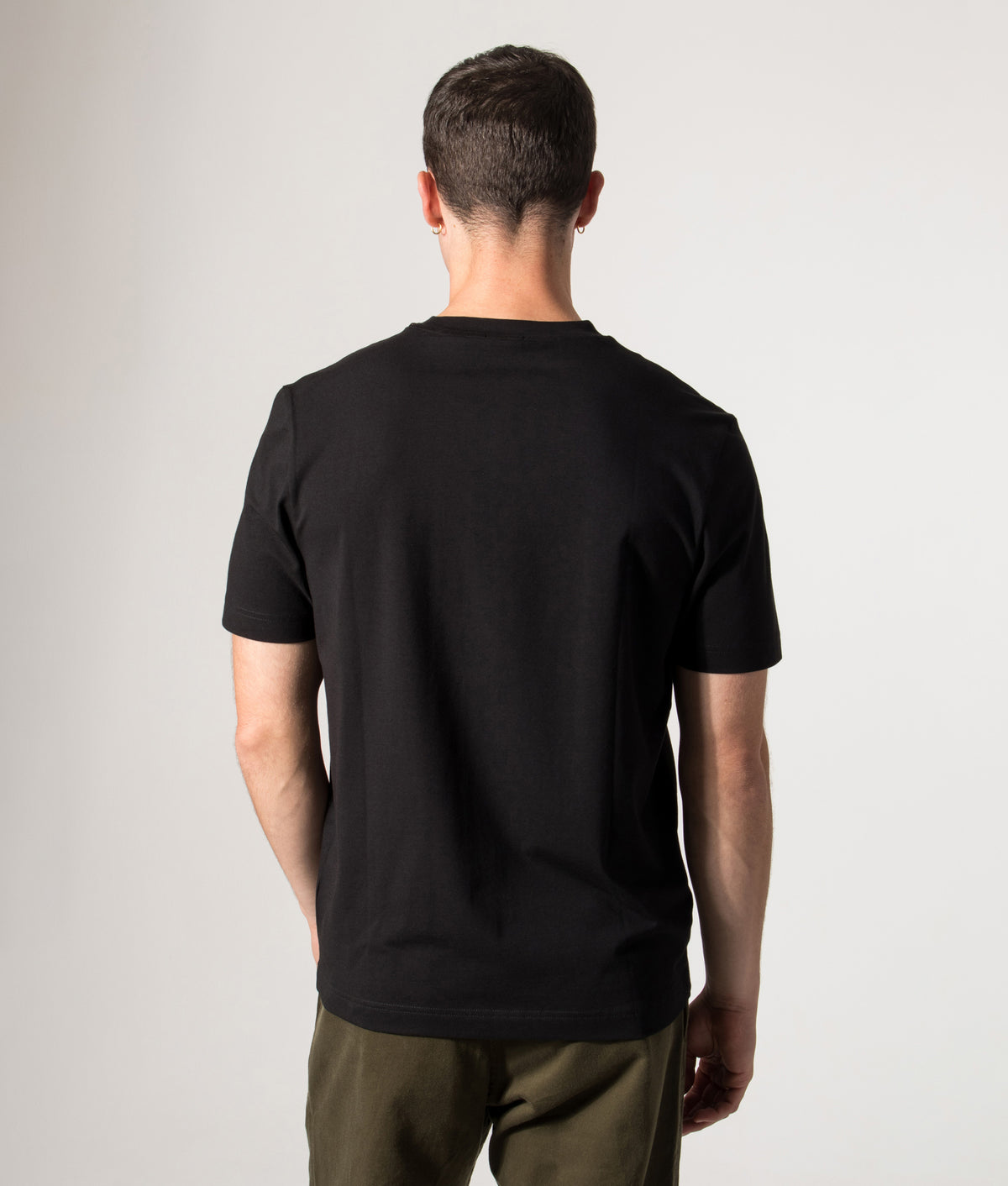 BOSS Relaxed Fit TChup T-Shirt in Black at EQVVS Menswear. Model back shot.