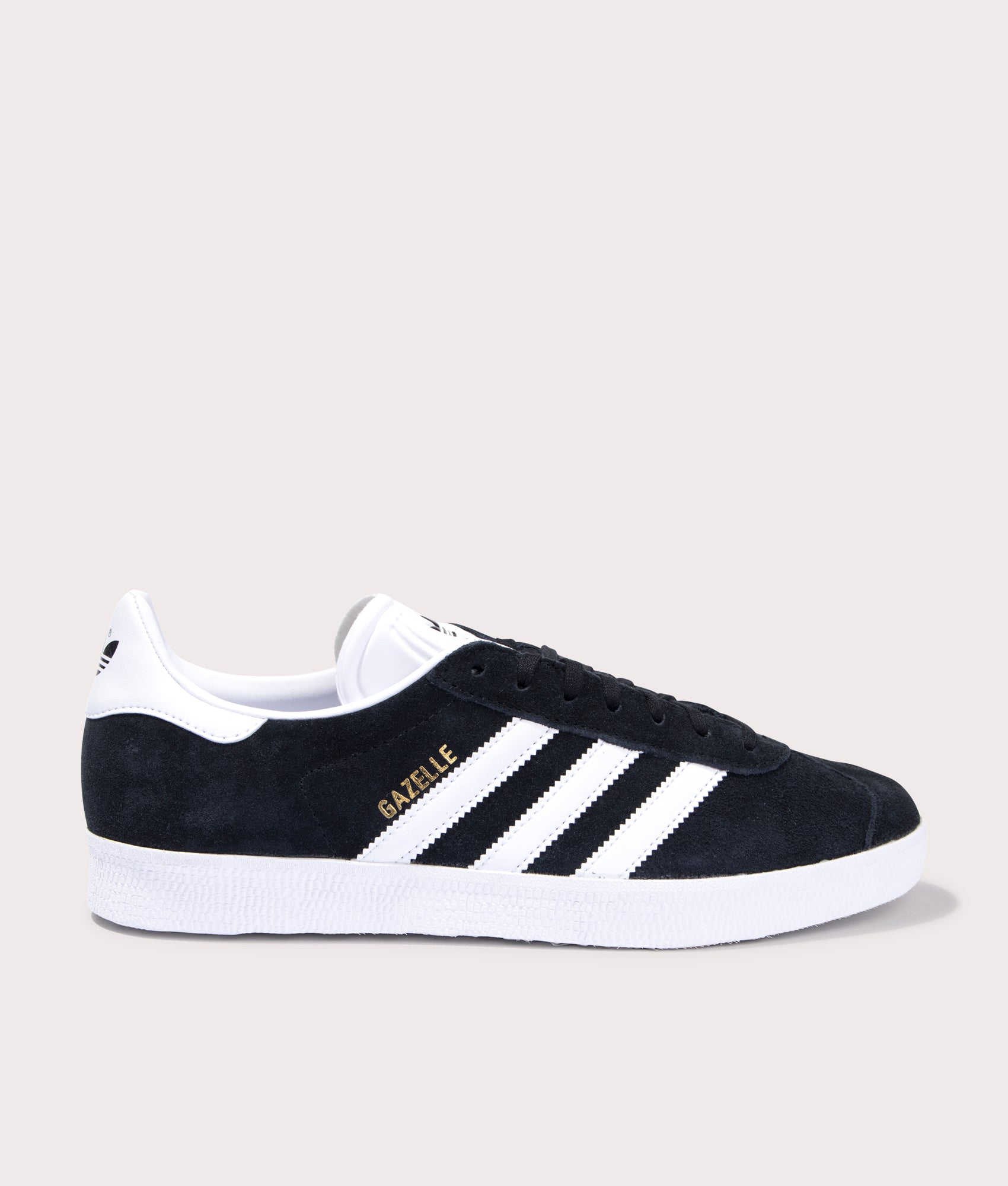 adidas Originals Gazelle Trainers in Core Black/White/Gold Metallic at EQVVS. Side solo shot. 