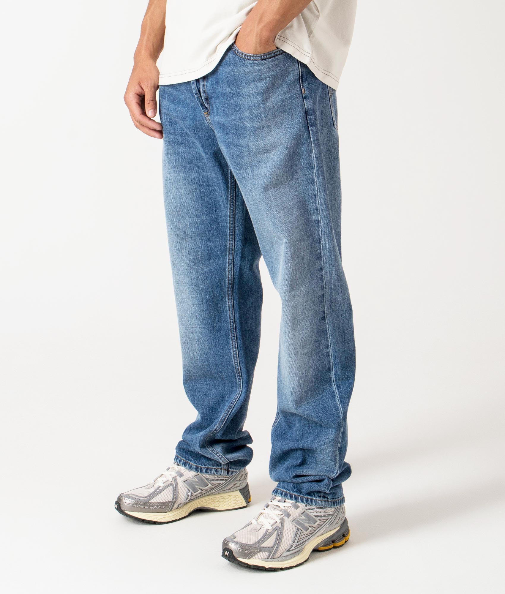 Carhartt WIP Marlow Jeans - Blue Rinsed Jeans - EQVVS. Angle shot. 