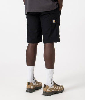 Aviation Cargo Shorts in Black by Carhartt WIP. Back shot at EQVVS.