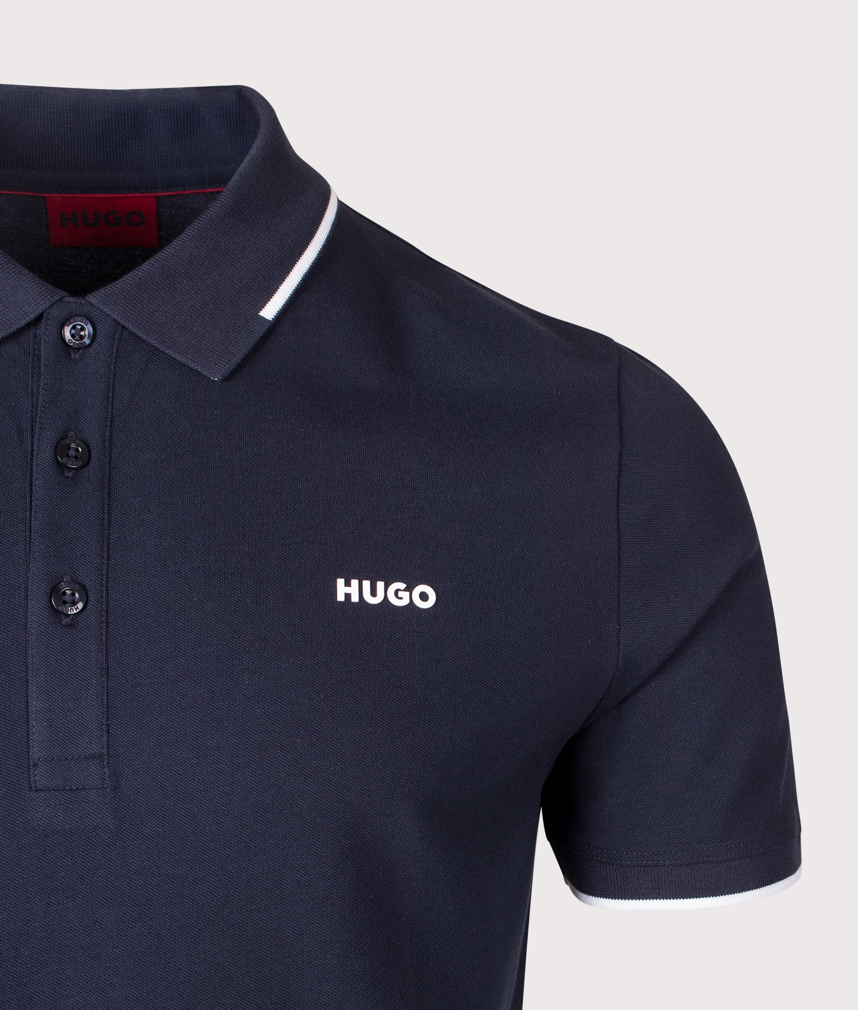 HUGO Slim Fit Dinoso222 Polo Shirt in Dark Blue at EQVVS Menswear. Detail shot.