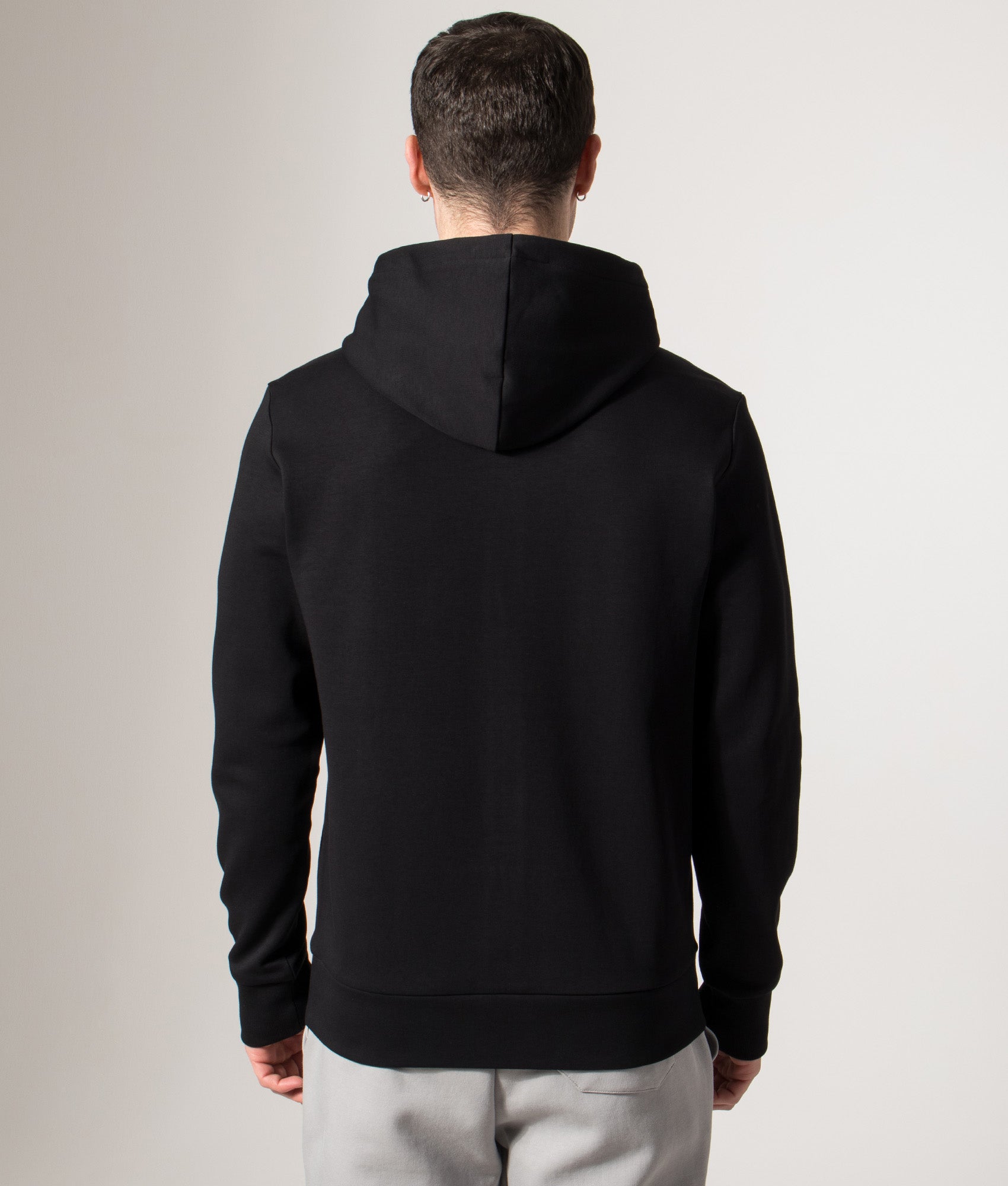 BOSS Saggy Hoodie in Black at EQVVS Menswear. Back model shot. 