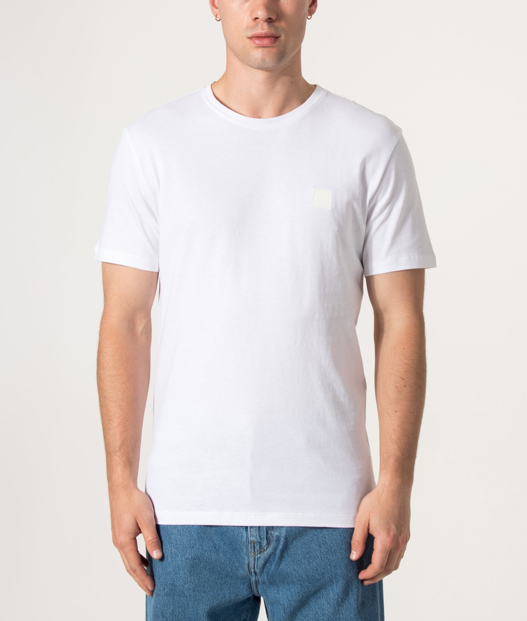 Boss Regular Fit Tales T-Shirt in White at EQVVS Menswear. Model front shot.