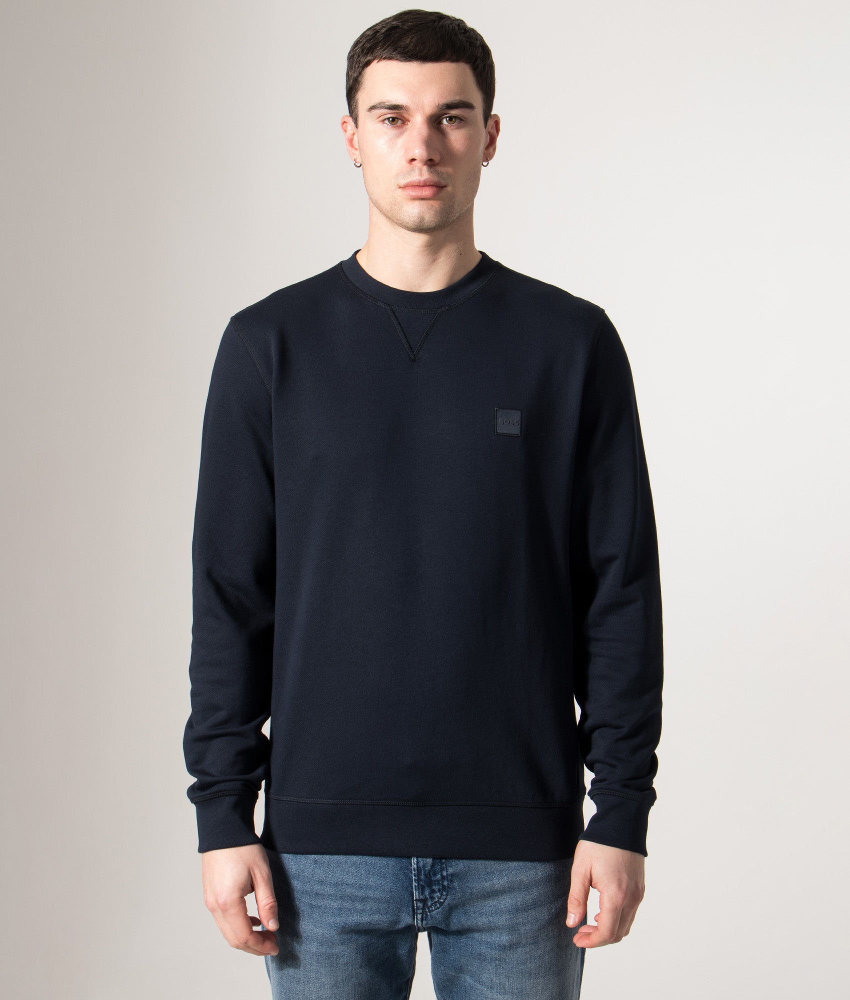 BOSS Relaxed Fit Westart Sweatshirt in Dark Blue at EQVVS Menswear. Model front shot.