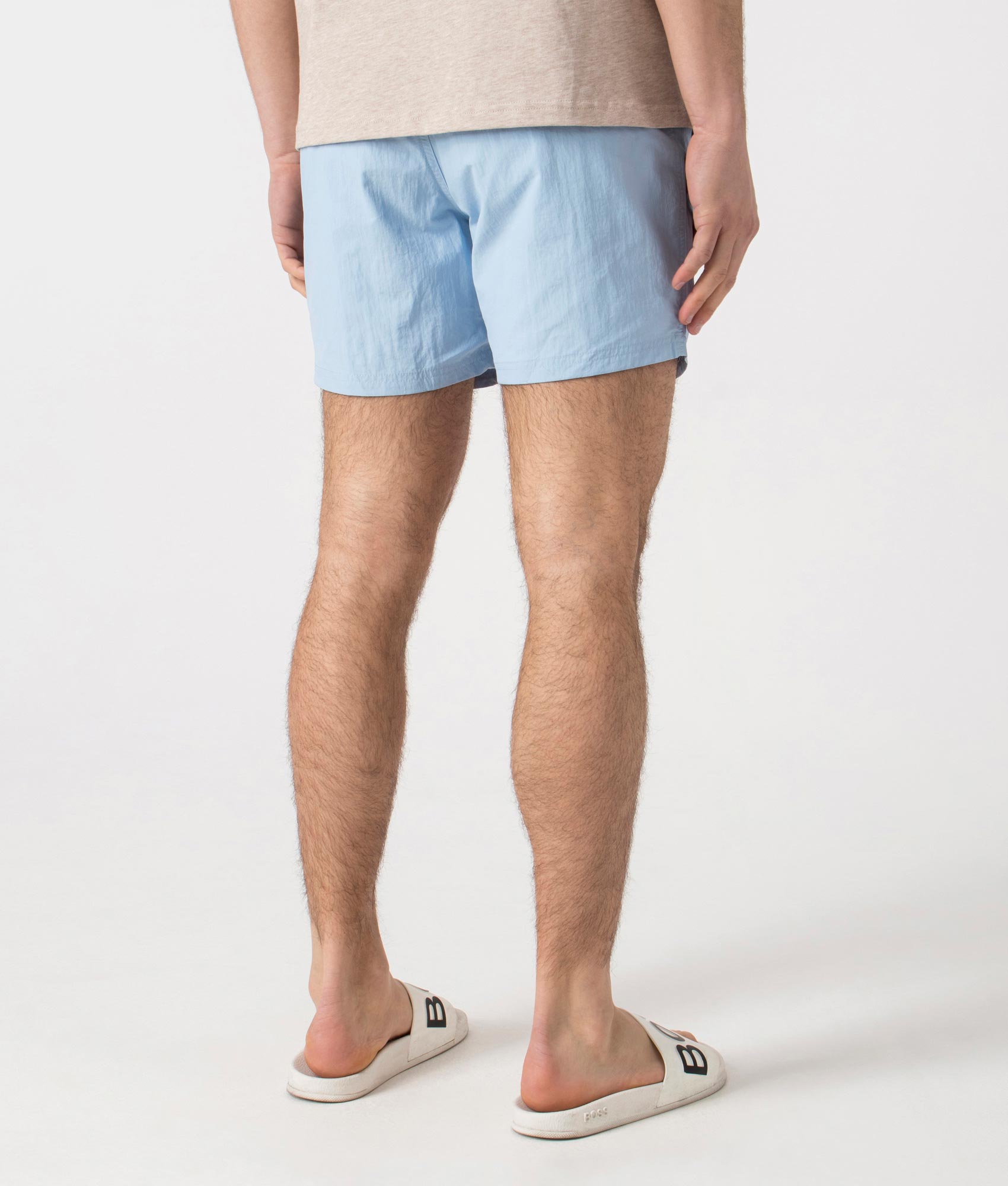 BOSS Octopus Swim Shorts in Light/Pastel Blue. Back angle shot at EQVVS
