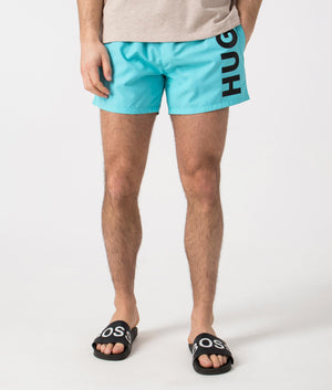 HUGO ABAS Lined Swim Shorts in Turquoise/Aqua. Front angle shot at EQVVS.