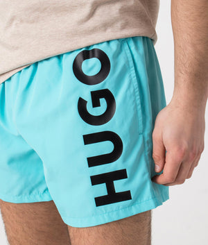 HUGO ABAS Lined Swim Shorts in Turquoise/Aqua. Detail shot at EQVVS.