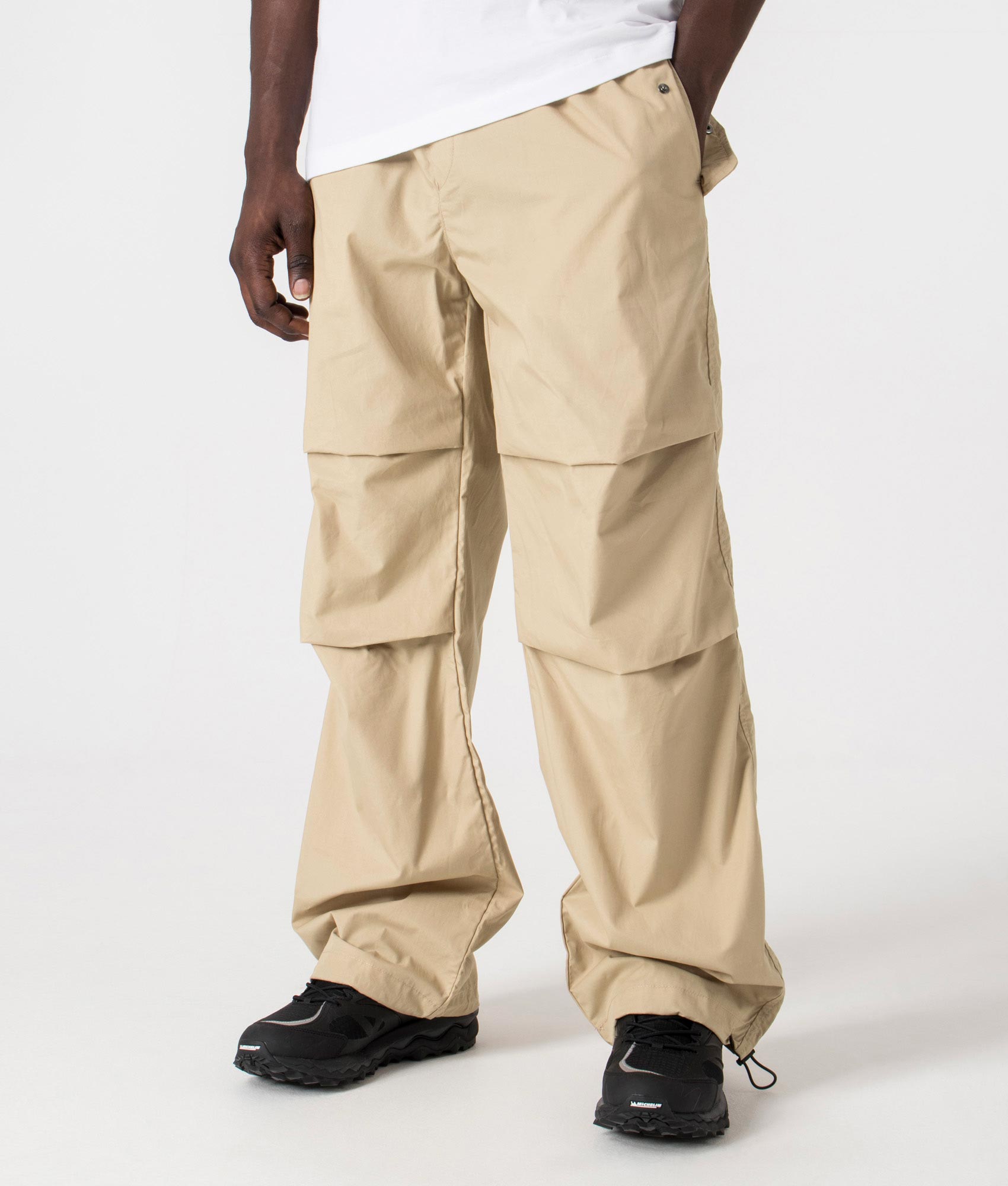 Genet242 Parachute Pants in Medium Beige by HUGO. EQVVS Side Angle Shot.