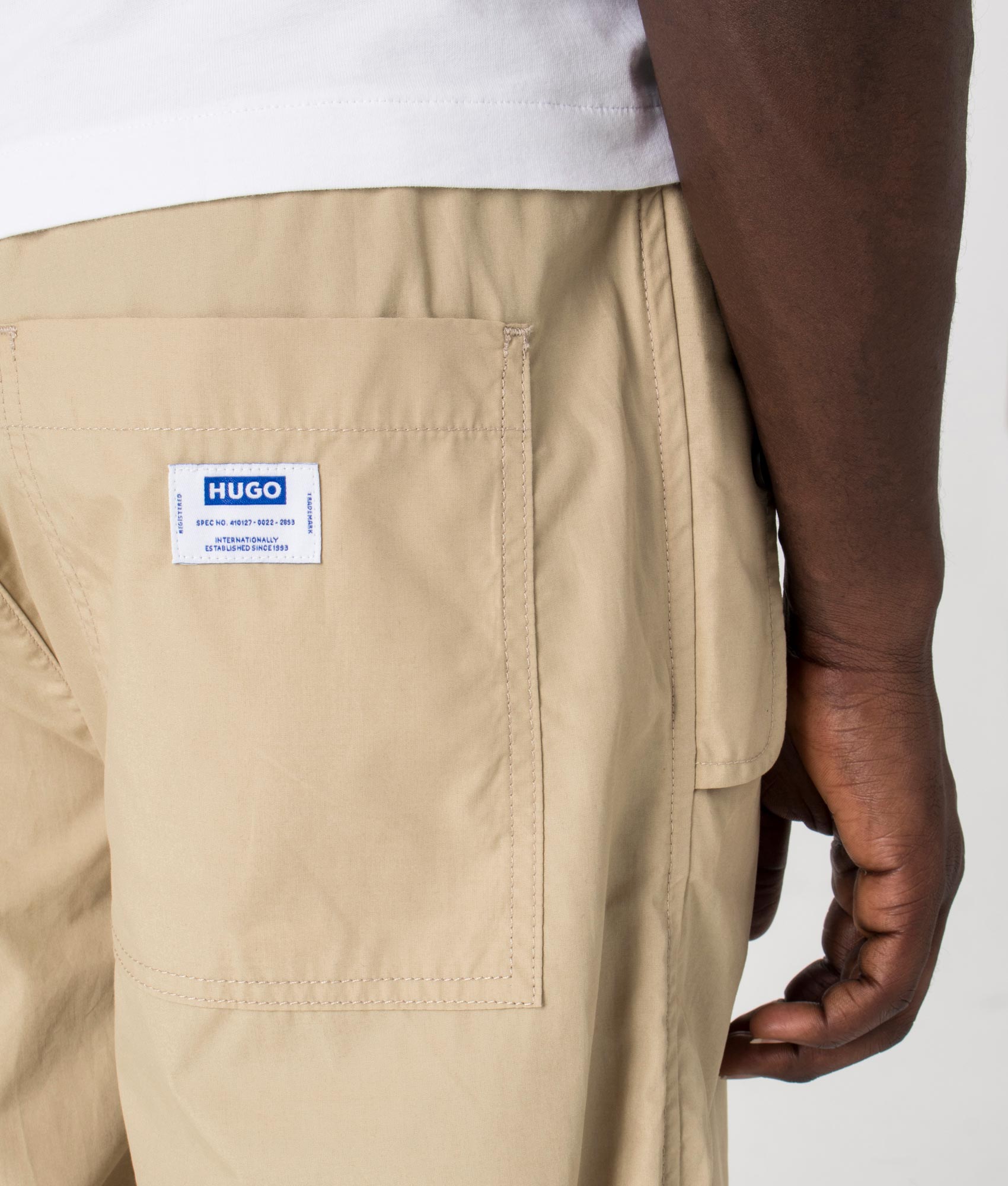 Genet242 Parachute Pants in Medium Beige by HUGO. EQVVS Detail Shot.