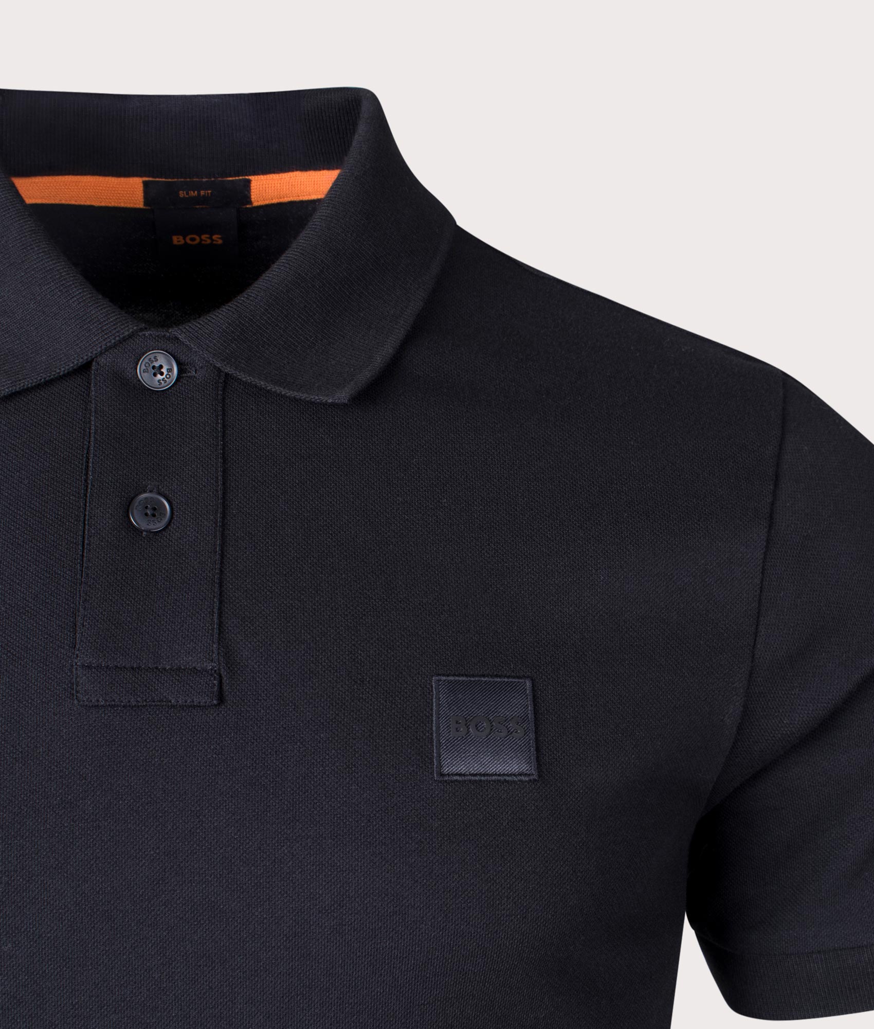 Boss Slim fit Passenger Polo Shirt in Black at EQVVS Menswear. Detail shot.