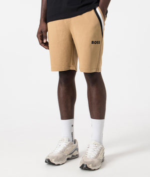 Iconic Sweat Shorts in Medium Beige by Boss. EQVVS Side Angle Shot.