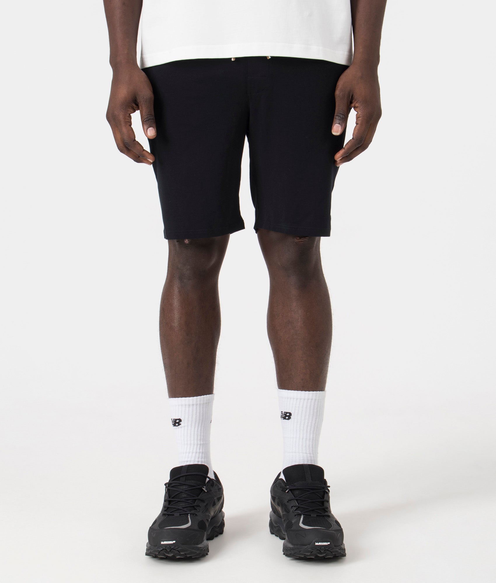 Lightweight Unique Shorts in Black by BOSS. EQVVS Model Shot.