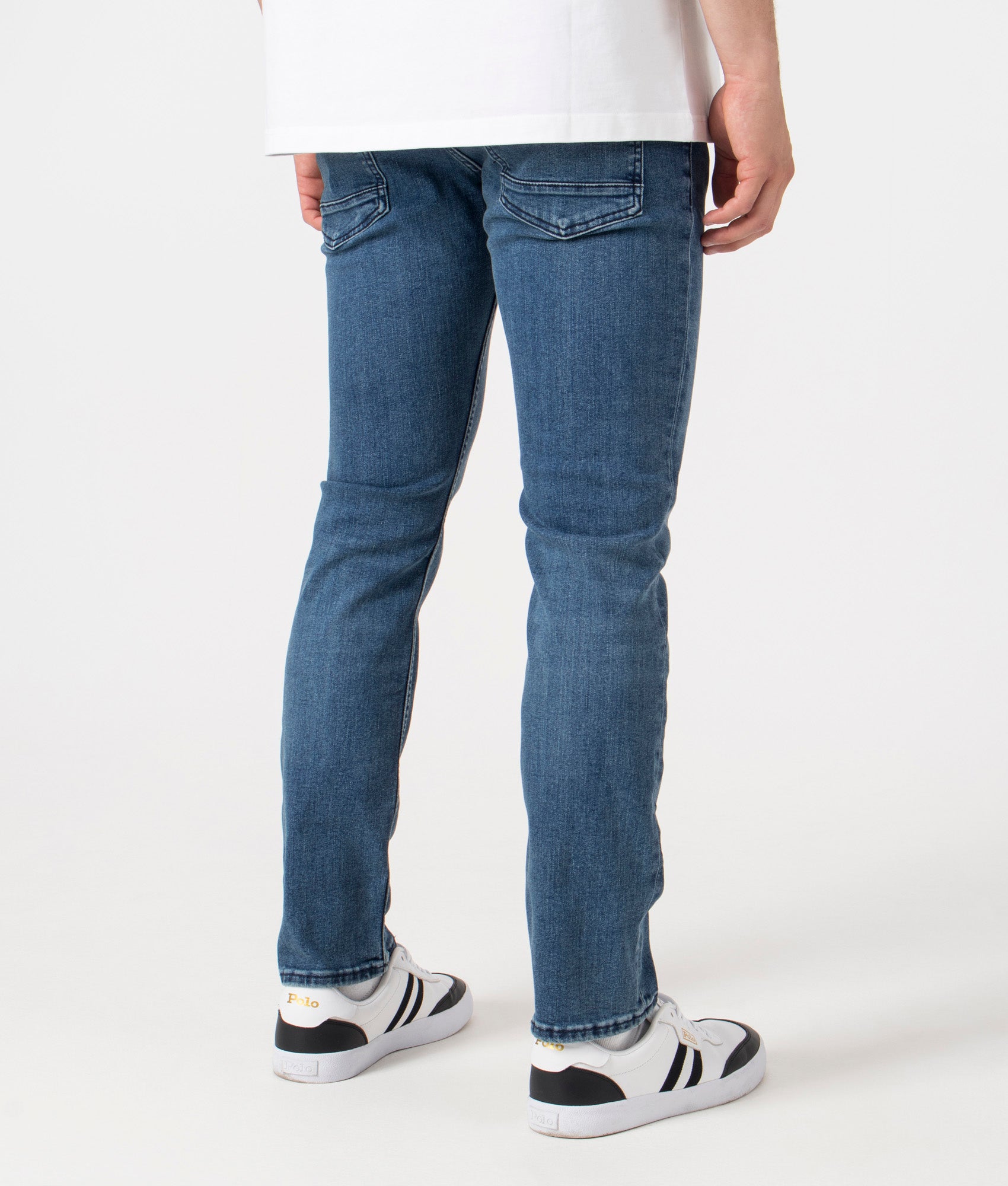 BOSS Slim Fit Delaware BC-P Jeans in Bright Blue. Back model shot at EQVVS.