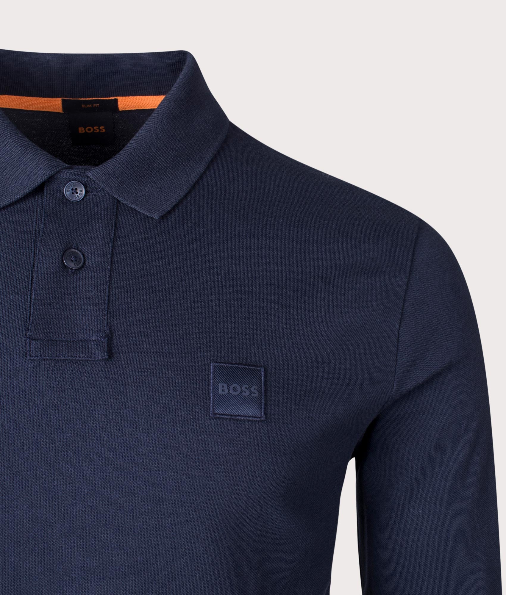 Boss Slim Fit Passerby long sleeve Polo Shirt in Dark Blue at EQVVS Menswear. Detail shot.