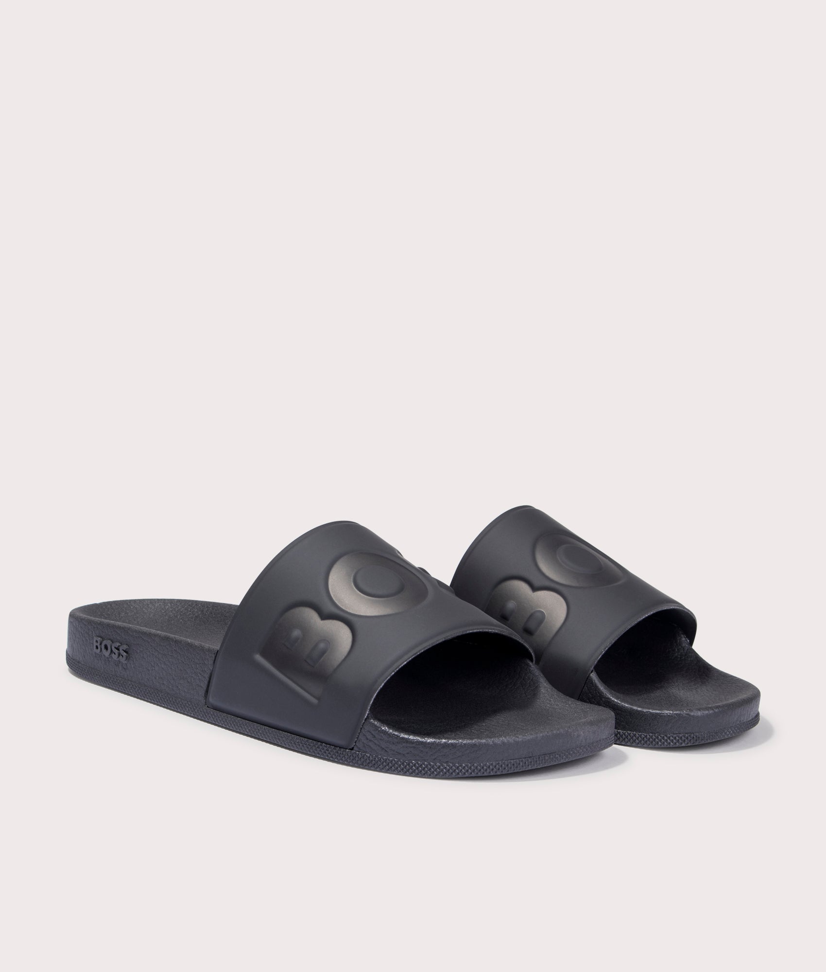 BOSS Aryeh Sliders in Black. Front angle shot at EQVVS.