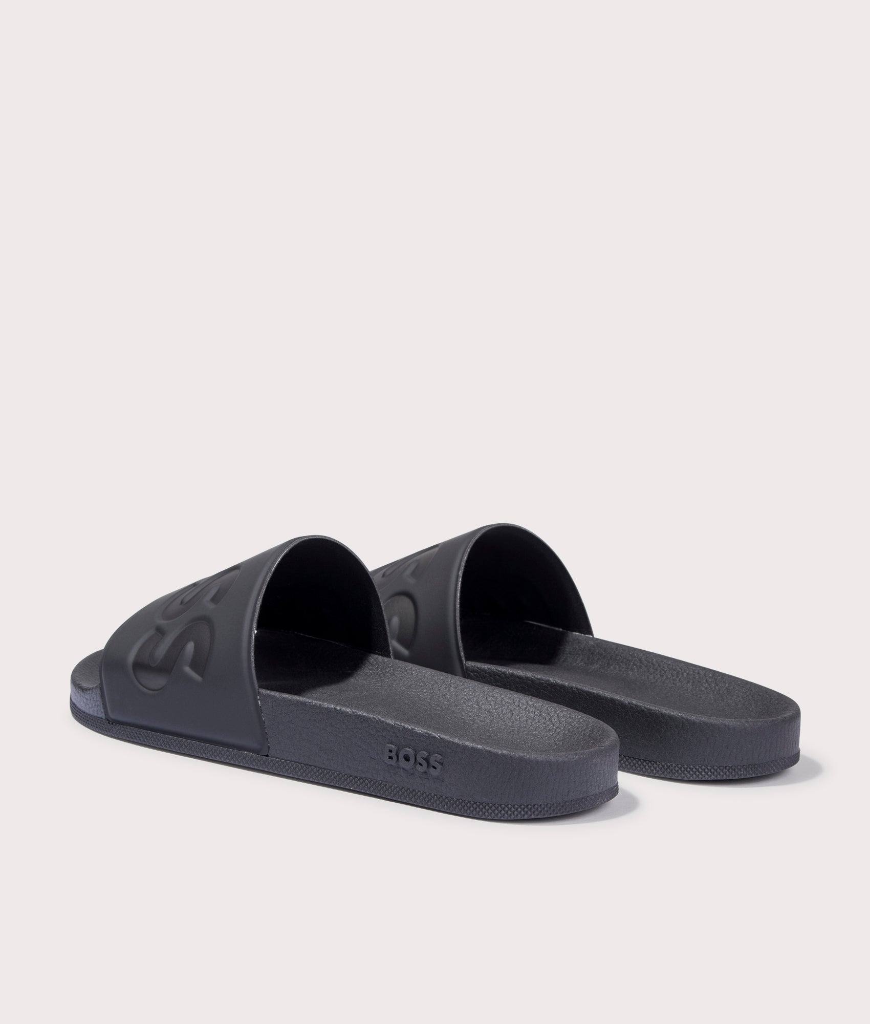BOSS Aryeh Sliders in Black. Back angle shot at EQVVS.