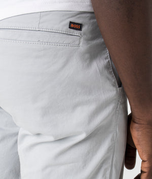 BOSS Slim Fit Chino Shorts in Light/Pastel Grey. Detail shot at EQVVS.