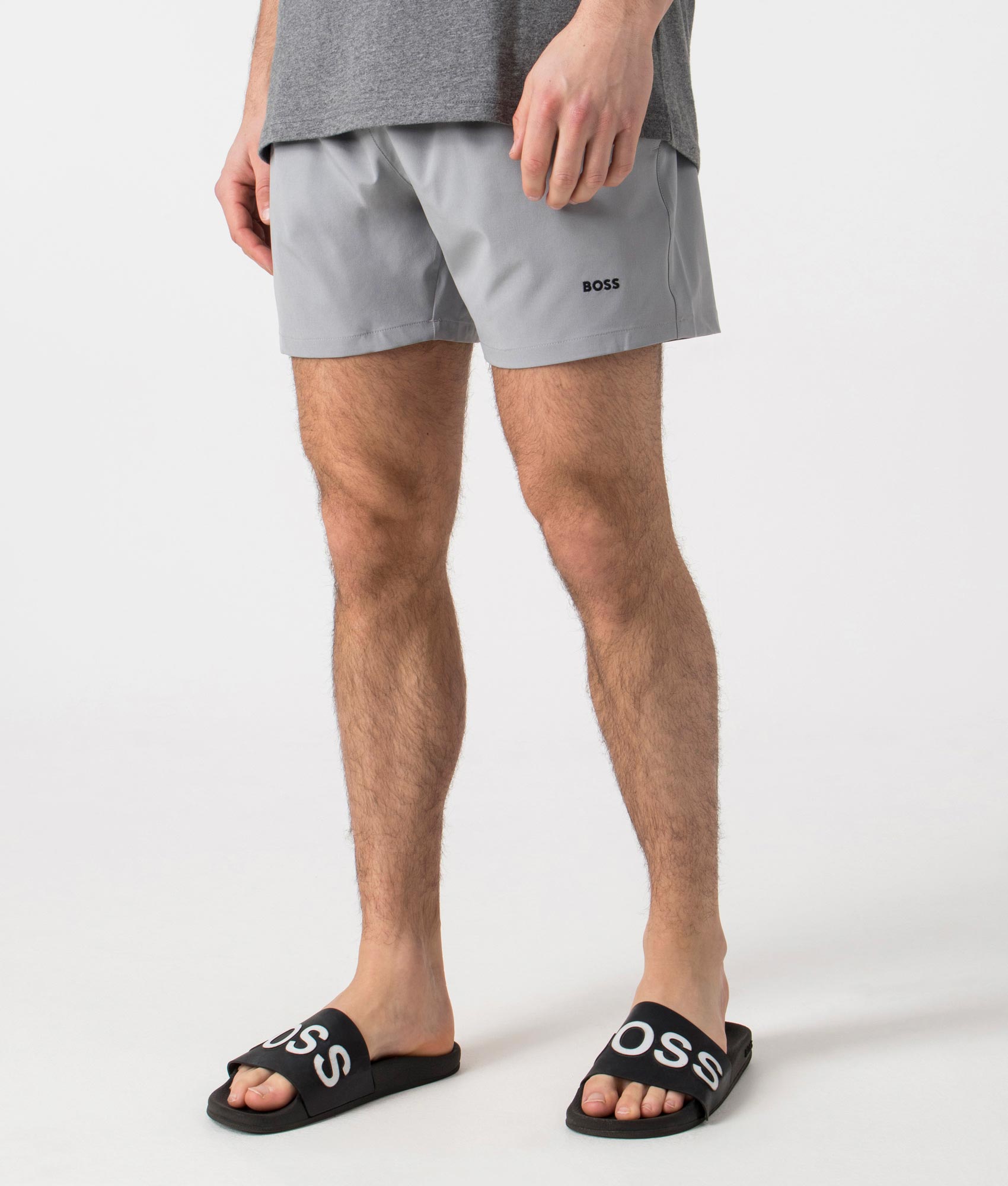 BOSS Tio Swim Shorts in Silver. Side angle shot at EQVVS.