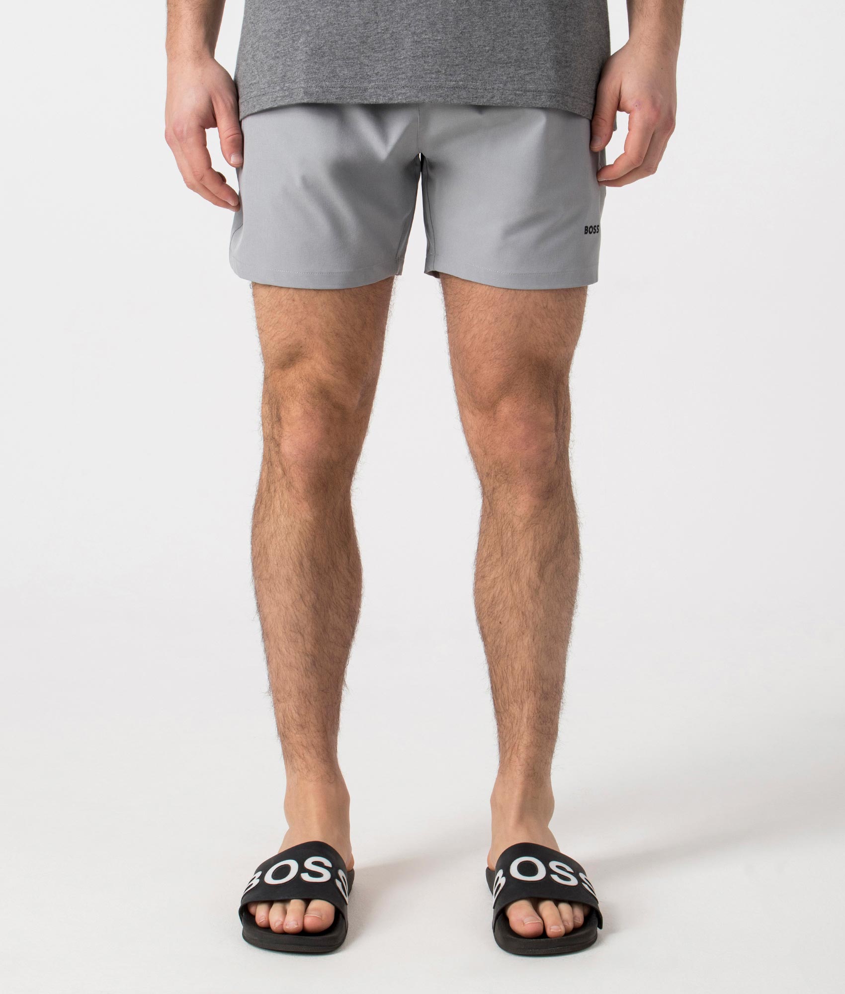 BOSS Tio Swim Shorts in Silver. Front angle shot at EQVVS.