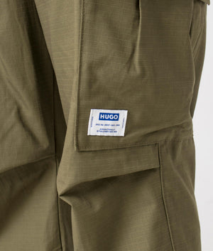 Relaxed Fit Gadic242 Cargos in Open Green by Hugo. EQVVS Detail Angle Shot.