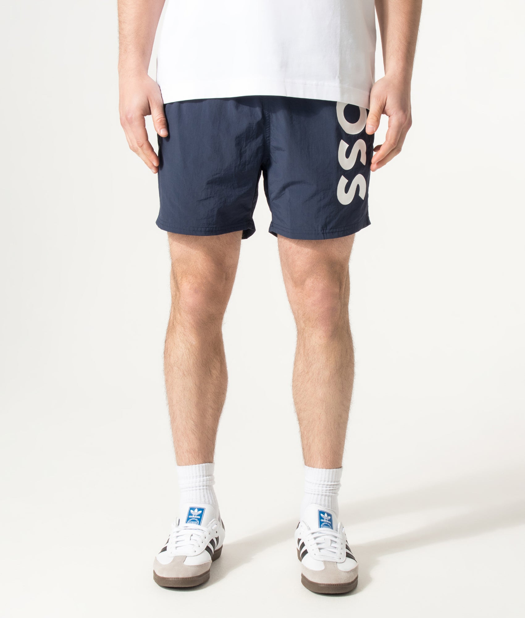 BOSS Octopus Swim Shorts in Navy at EQVVS Menswear. Model front shot.