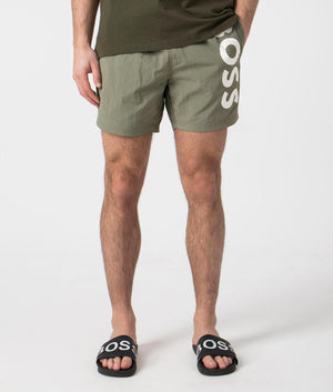 BOSS Octopus Swim Shorts in Beige/Khaki. Front angle shot at EQVVS.