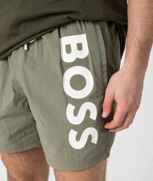 BOSS Octopus Swim Shorts in Beige/Khaki. Detail shot at EQVVS.