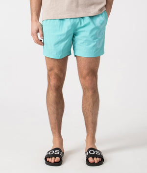 BOSS Octopus Swim Shorts in Turquoise/Aqua. Front angle shot at EQVVS.