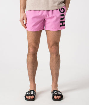 HUGO ABAS Lined Swim Shorts in Medium Pink. Front angle shot at EQVVS.