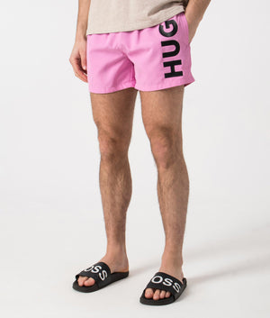 HUGO ABAS Lined Swim Shorts in Medium Pink. Side angle shot at EQVVS.