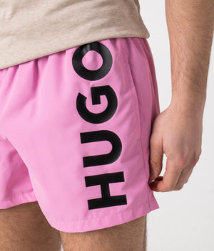 HUGO ABAS Lined Swim Shorts in Medium Pink. Detail shot at EQVVS.