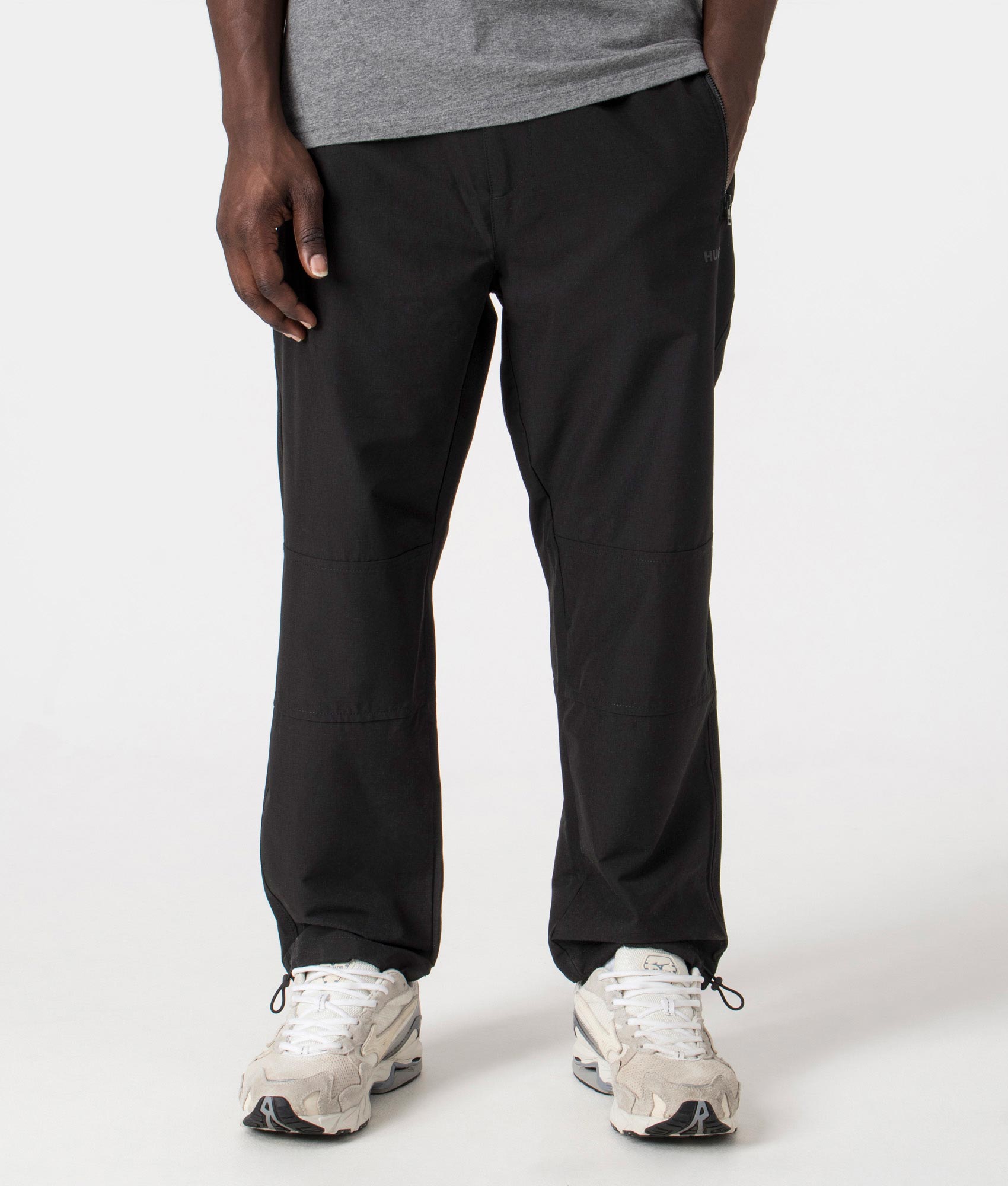 Gendo242 Parachute Pants in Black by HUGO. EQVVS Front Angle Shot