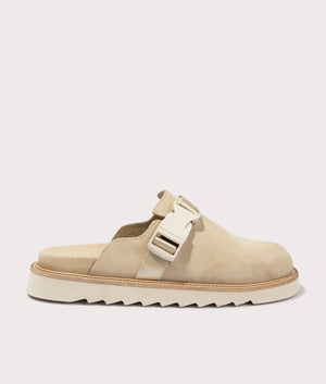 Syrax Slon Suede Mules in Light Beige. Side angle shot at EQVVS.