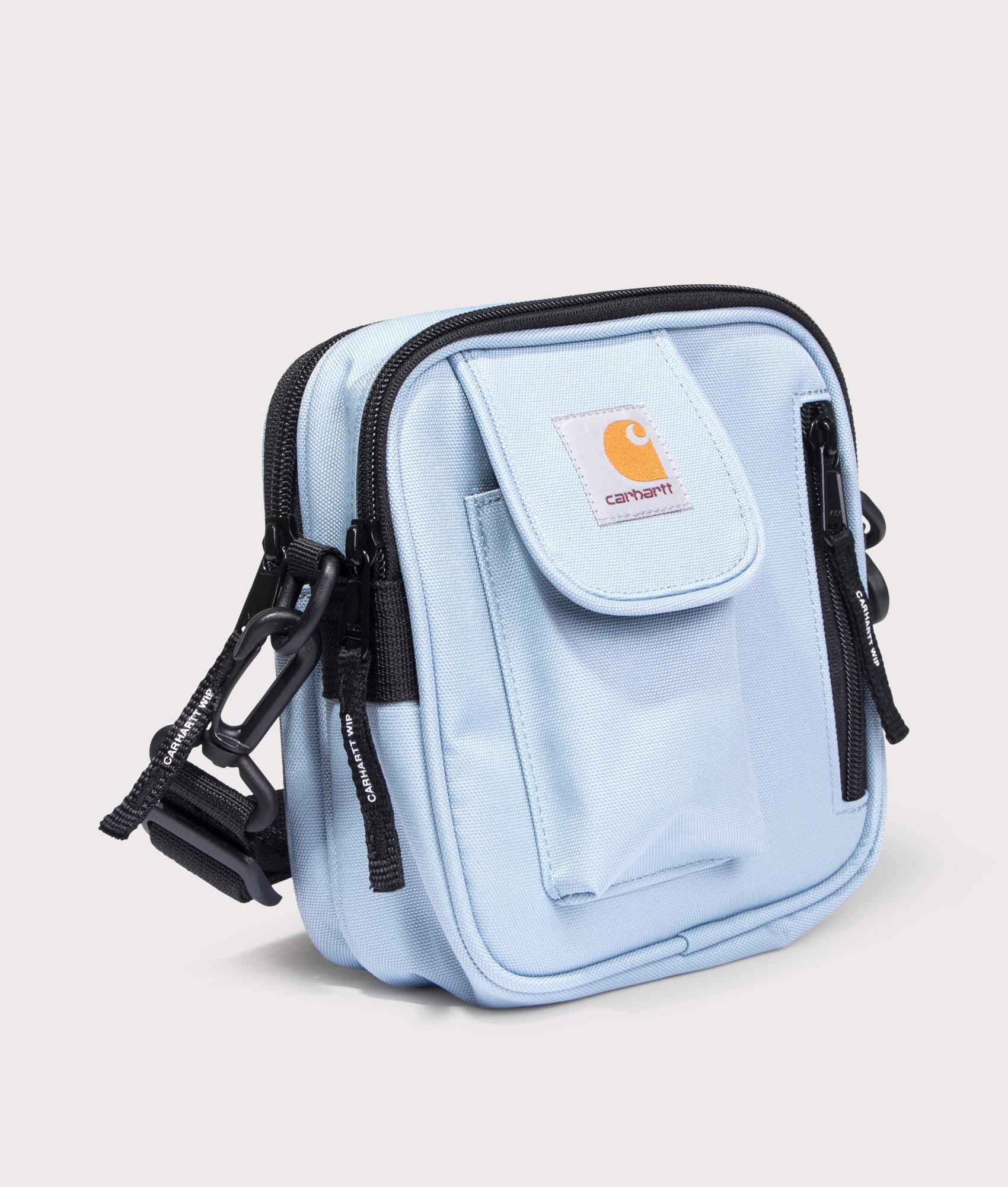 Carhartt WIP Small Essentials Bag in Misty Sky. Side angle shot at EQVVS.