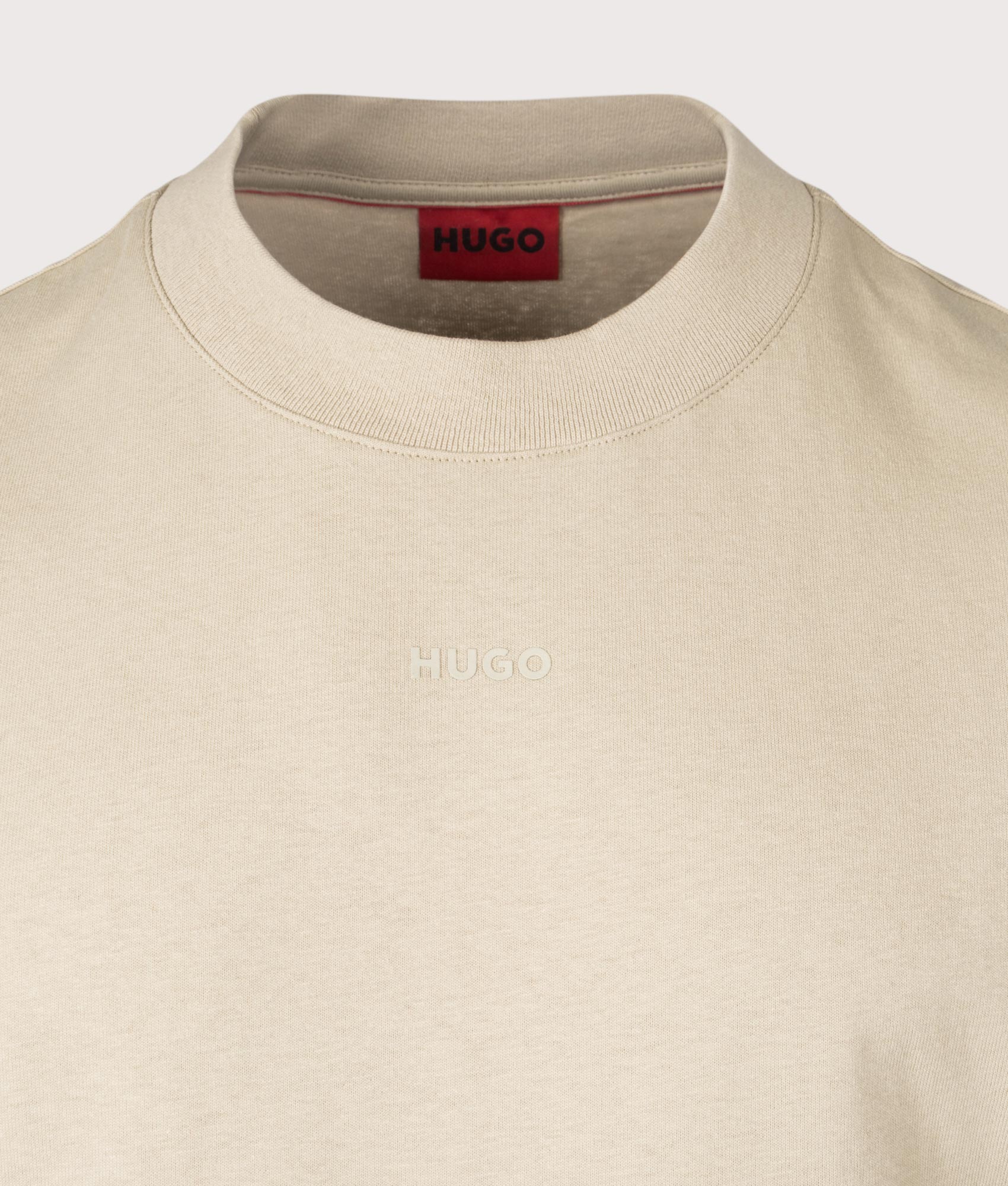HUGO Relaxed Fit Dapolino T-Shirt in Open Beige. Detail angle shot at EQVVS.