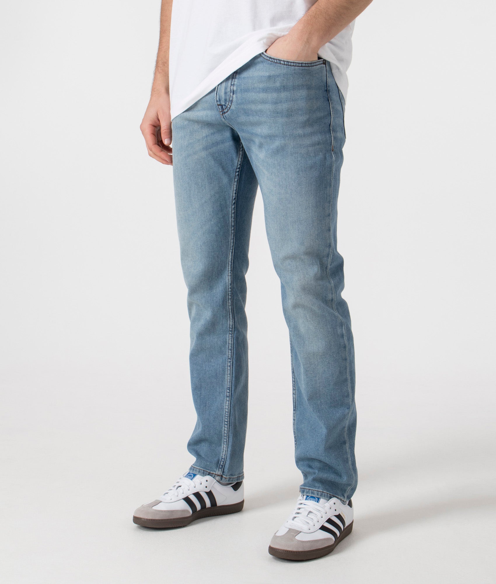 BOSS Delaware Jeans in Bright Blue at EQVVS Menswear. Angled front shot.